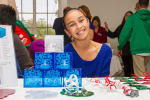 Eighth Grade Student Selling Acrylic Candle Holders and Ornaments