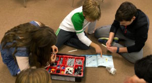 Garden Street Academy 6th Grader Assembling Lego Wind Turbines