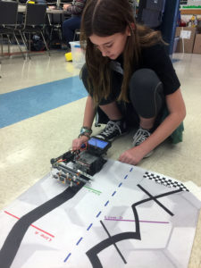 Middle School Student Testing Robot at Garden Street Academy Robotics Team Botball Workshop